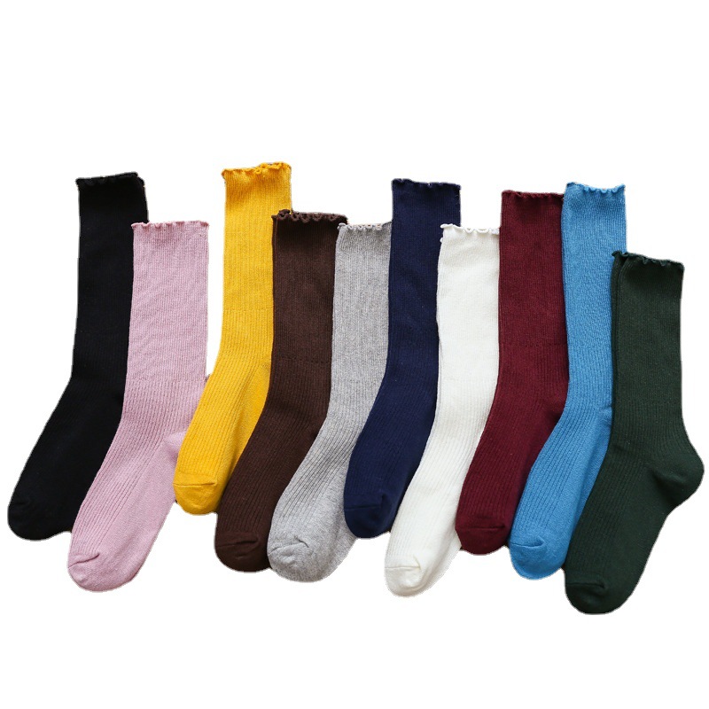 Primavera y otoño de las mujeres delgadas de algodón oreja de madera doble aguja pila calcetines japoneses retro color sólido ins largos calcetines casuales al por mayor