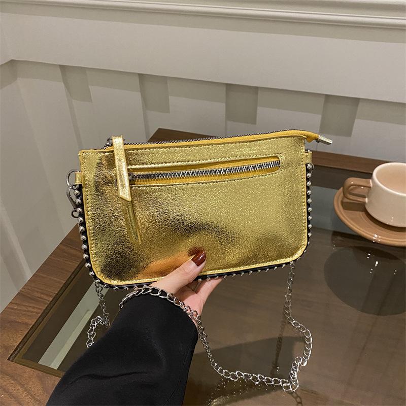 Casual coreano simple bolso de mano retrógrado personalidad bolso de mano para mujeres 2025 primavera nueva moda brillante bolso de hombro