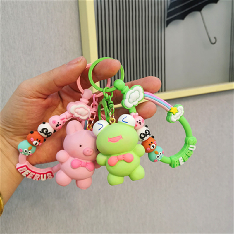 Colorido Berus dibujos animados cuerda Rana conejo llavero colgante Cadena de teléfono móvil fresco color sólido conjunto auriculares