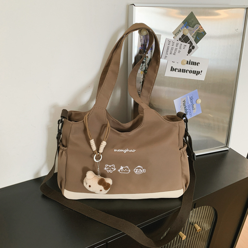 2026 nuevo lindo bolso de tote nicho de moda simple textura de viaje universal mujer gran capacidad mochila de hombro