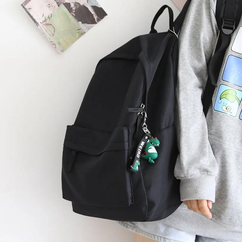 Universal solid color capacious black backpack