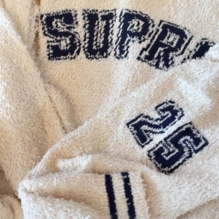 SS25 TEXTURED ARC SWEATER ë�që��