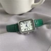 Silver shell green belt