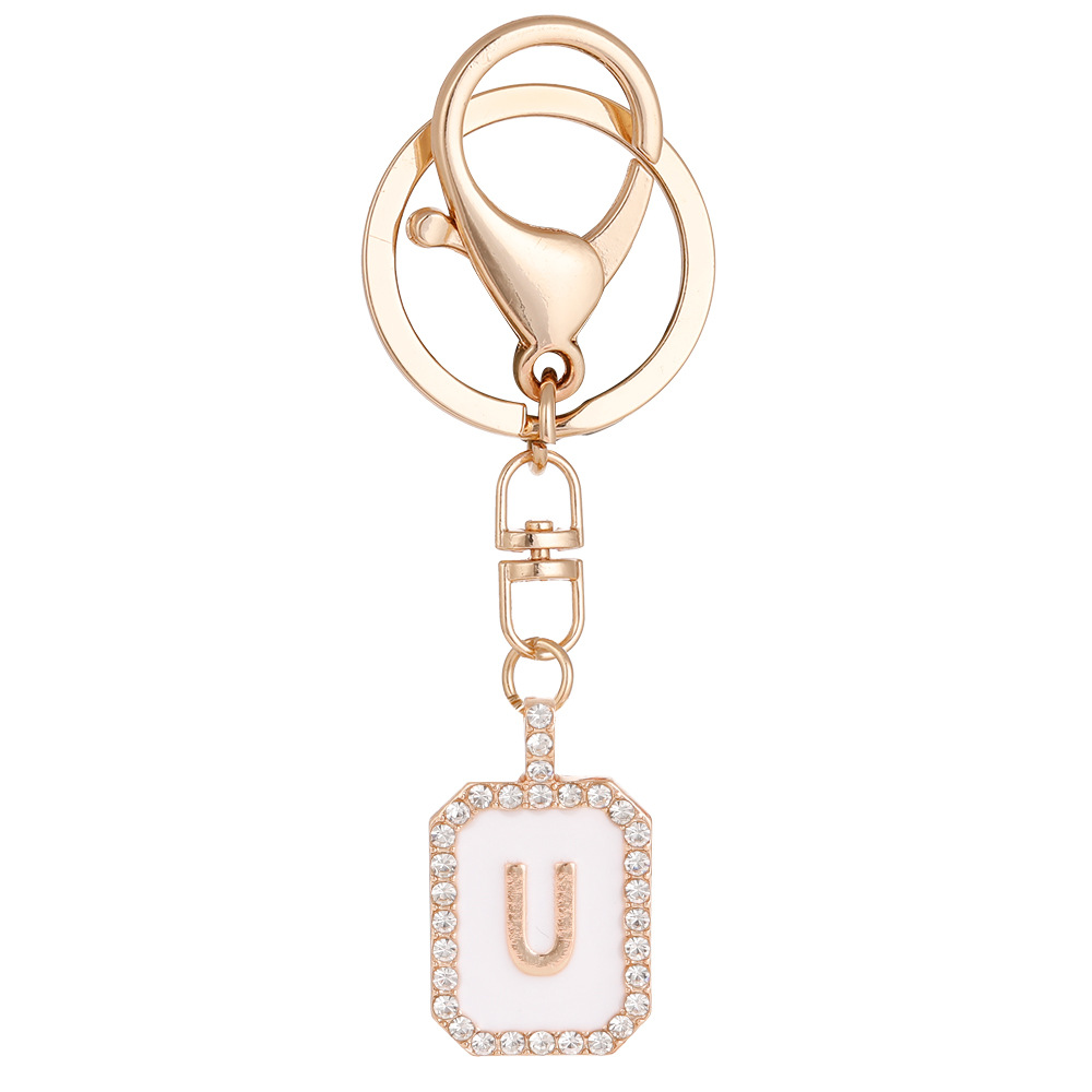 Nueva moda 26 cartas gota de diamante aceite llavero bolso del auricular pareja colgante vacaciones pequeño regalo al por mayor