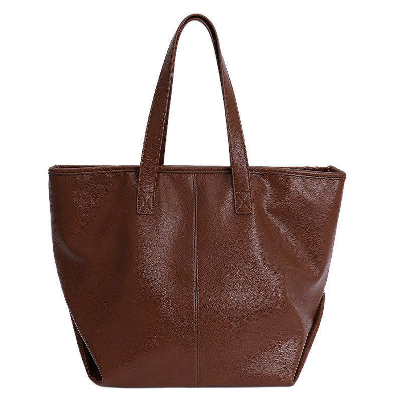 Bolsa de moda retro de gran capacidad para mujeres 2025 nueva simple versátil alta sensación de mochila de viaje diario