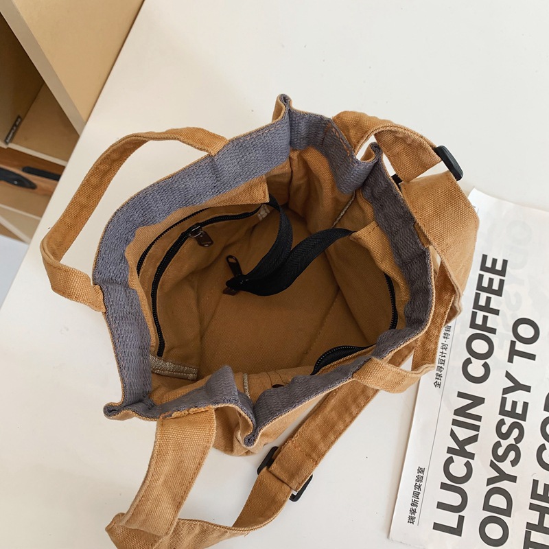 Bolso de lona lavado para mujer 2024 nuevo bolso de hombro minimalista literario de moda todo fósforo bolso diagonal portátil al por mayor