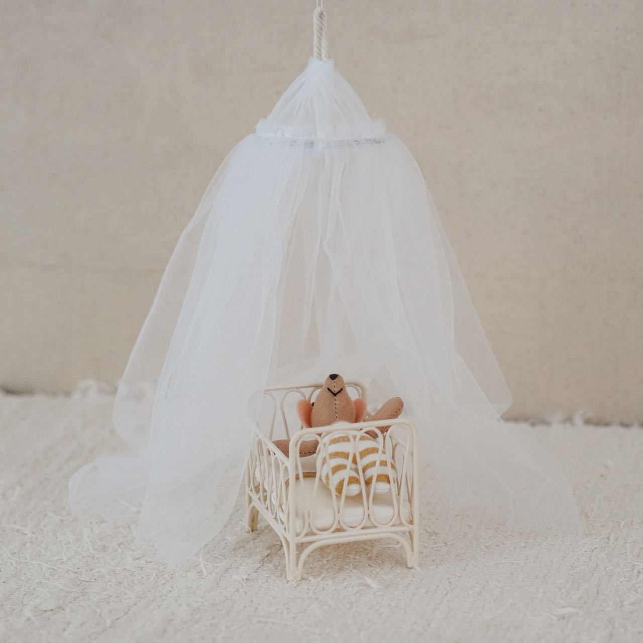 Cute miniature dollhouse furniture, ethereal bed canopy, miniature model scene on Instagram.
