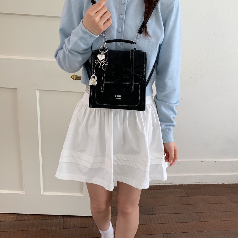 Mochila de temperamento de viaje femenino 2026 de alto valor de cara simple coreana mochila de viaje nuevo arco bolso pequeño
