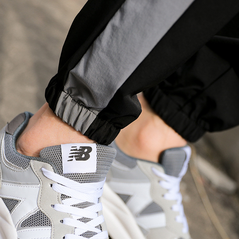 Nuevos pantalones deportivos, pantalones casuales delgados de otoño para hombres, pantalones de guardia de tres barras sueltos de tendencia, fábrica al por mayor