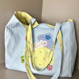 日系大容量卡通可爱双面帆布包2025新款学生上课通勤包单肩托笙陇