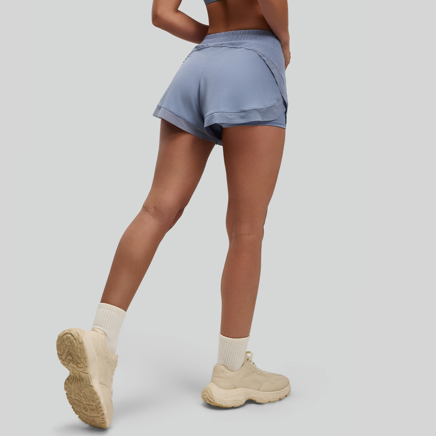 Fábrica que procesa y personaliza pantalones cortos de malla, pantalones cortos deportivos, pantalones cortos de yoga sin costuras con bolsillos y tacto suave para mujer.