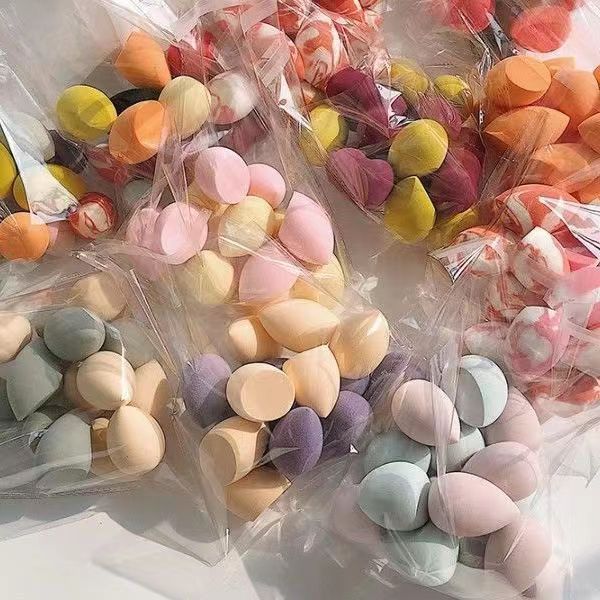 Una bolsa grande de múltiples no comer polvo belleza huevo maquillaje soplo esponja huevo no comer polvo herramientas de maquillaje gota de agua oblicua