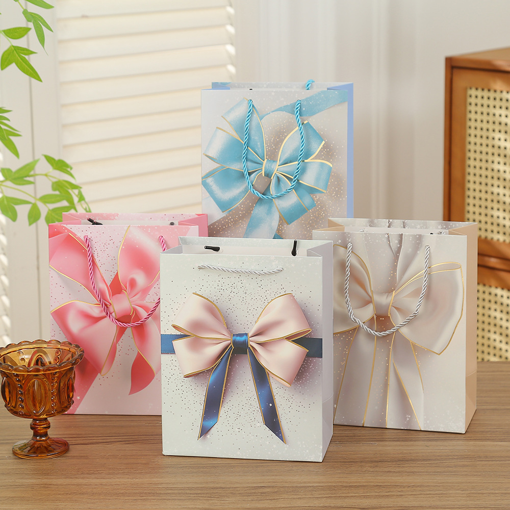 Bolsas de regalo de San Valentín bolsas de embalaje de arco bolsas de regalo de vacaciones Qixi papel cartón blanco estampado bolsas al por mayor