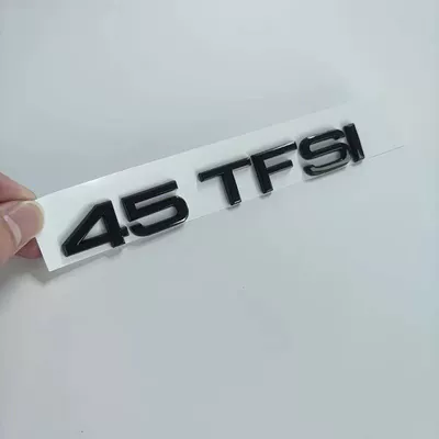 Car logo TTS black lettering, center grille - standard-45tfsi-gloss-black
