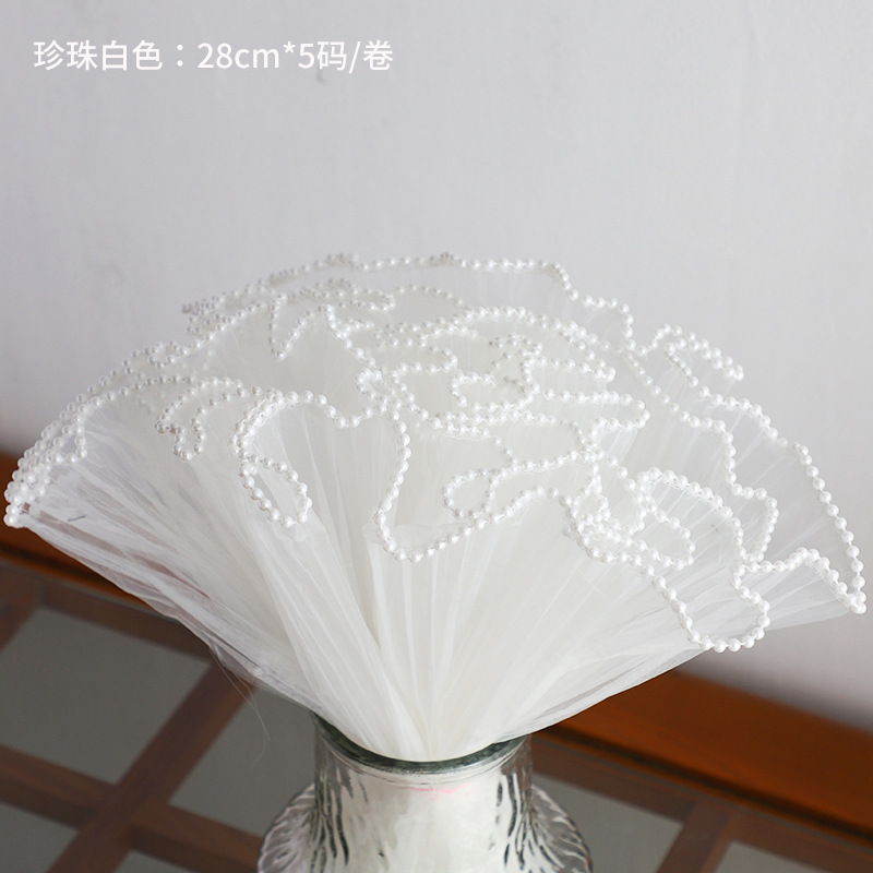 Material de embalaje de flores al por mayor nuevo estilo Chanel de una sola pieza que forma pieza redonda ramo bolsa de tela flor artefacto