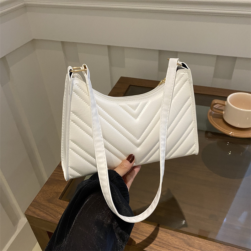 Nicho francés diseño bolso de brazaletes de diamante para mujeres 2024 verano nuevo estilo de moda de cadena universal bolso de hombro para chicas