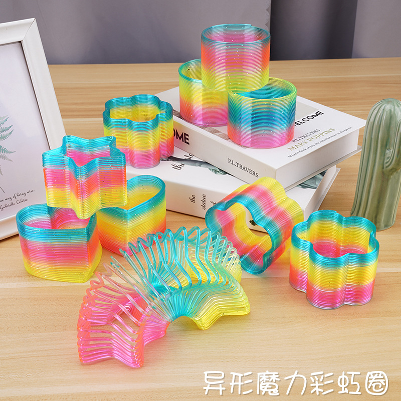 Venta caliente grande en forma de anillo Arco Iris puestos populares juguete mágico primavera anillo Yiwu juguete al por mayor