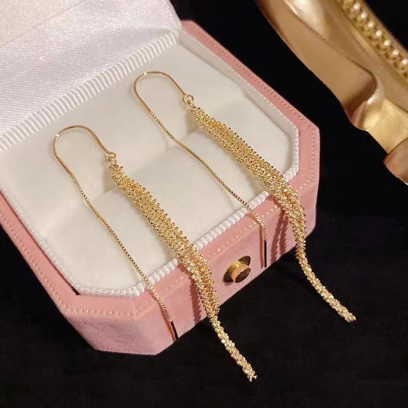 Brillante aretes de tetas de estrellas 2024 nueva personalidad temperamento de alta sensación de aretes largos tirando de aretes explosivos