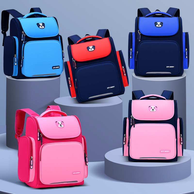 Mochila para estudiantes de primaria Mochila para hombres y mujeres para el grado 1-3-6 bolsa de espacio para niños que reduce la carga impermeable protección de la columna vertebral logotipo impreso