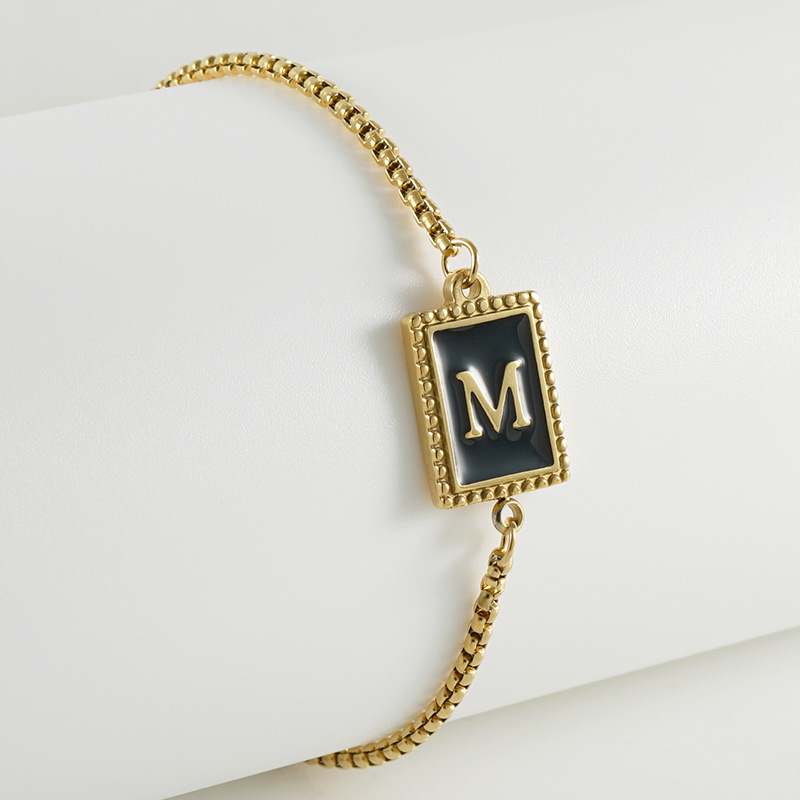 La moda europea y americana transfronteriza del acero inoxidable 26 pulsera inglesa de la letra en relieve pulsera Titanium de la cremallera del acero 18K de la frontera para las mujeres