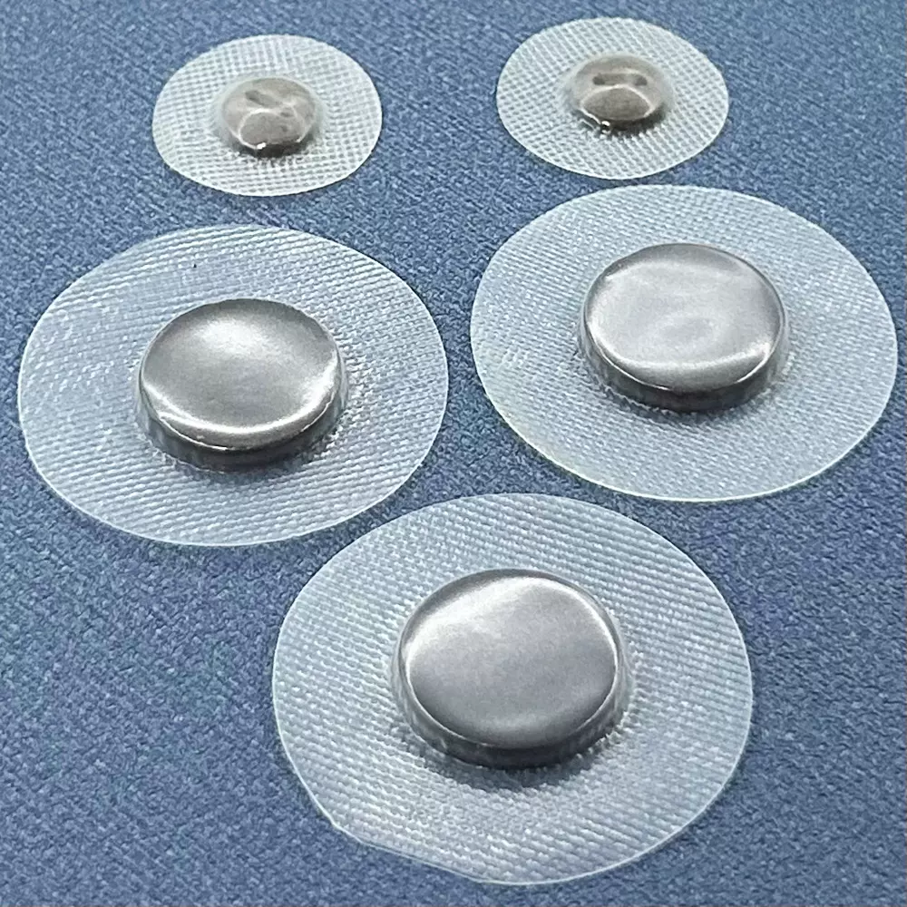 现货包胶膜负离子火山石纽扣服装辅料包纱布能量石远红外赭石装饰