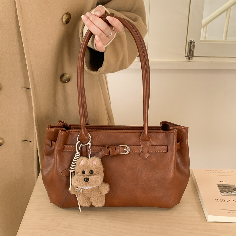 Otoño y invierno bolsas de mano de viaje de mujer bolsas retro de gran capacidad 2025 nuevas bolsas de hombro y brazales casuales versátiles