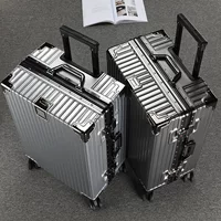 Capacious suitcase on wheels for men and women