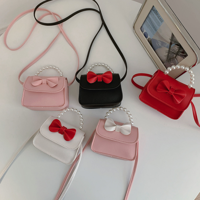 Bolsos para niños arco extranjero mini lindos bebés mochilas bolsos de perlas dulces bolsos de hombro para padres e hijos