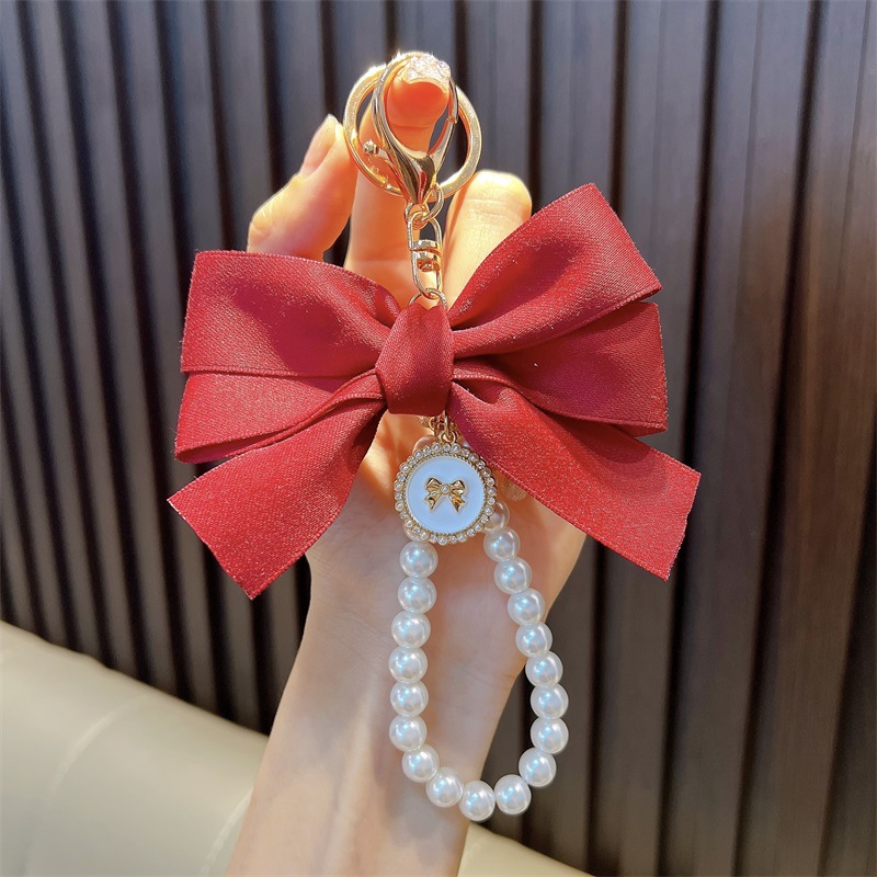 Perlas hechas a mano llaveros de perlas mujeres arco de correa de color bolsos colgantes pequeños regalos al por mayor