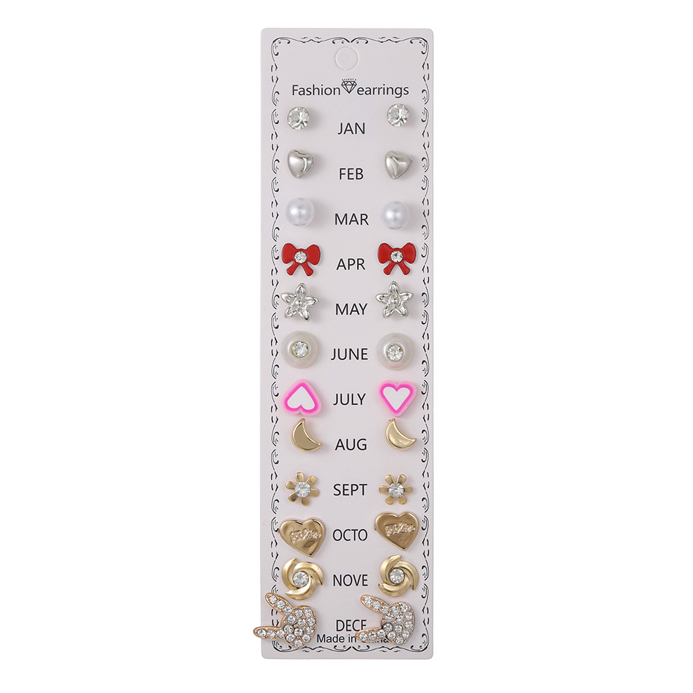 Set de 12 pares de aretes con flores y diamantes
