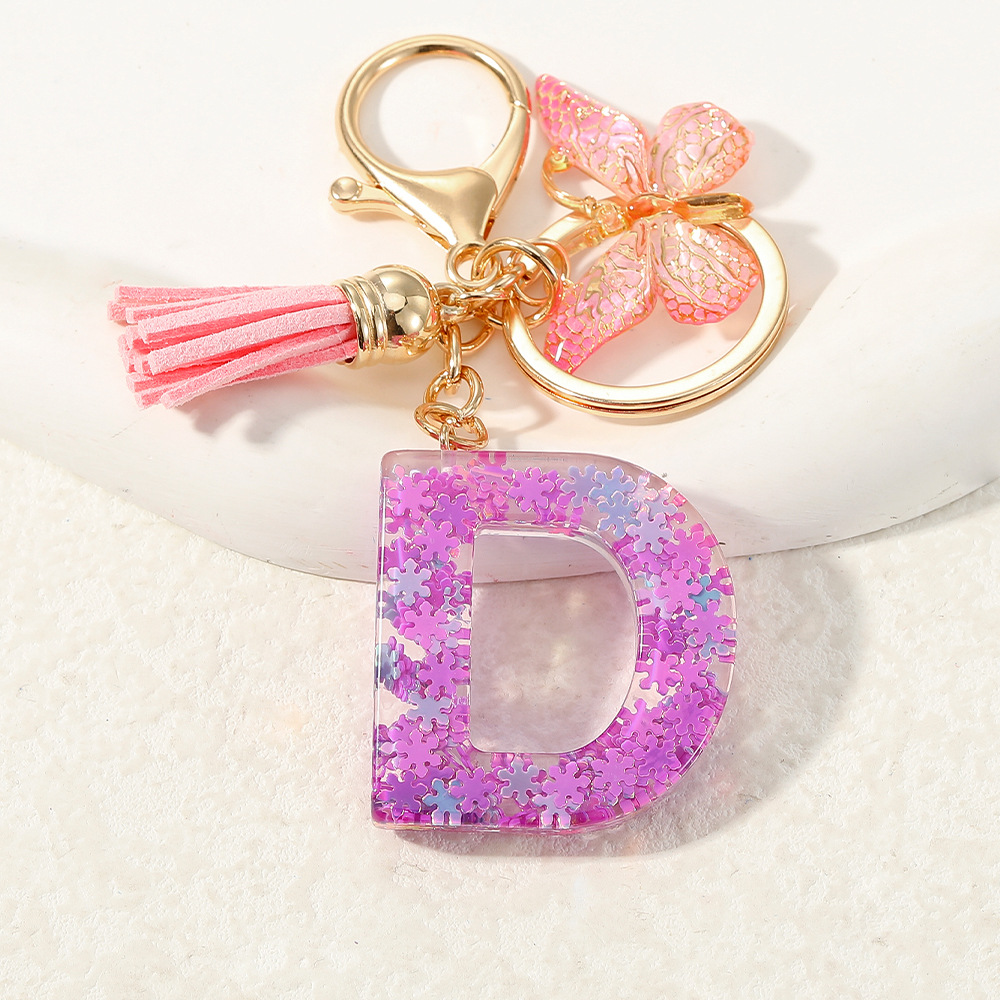 Nuevo color púrpura claro mezcla de polvo brillante letras inglesas resina llave colgante estilo simple mariposa borda colgante