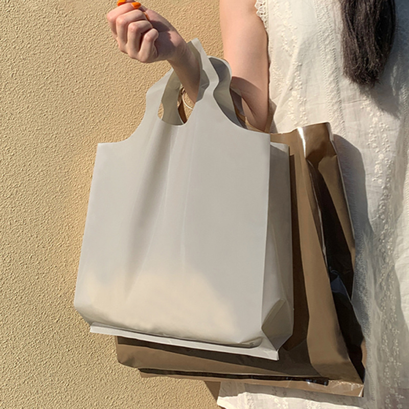 高檔圓口服裝店手提袋加厚塑料衣服用購物禮品包裝打包袋可批發