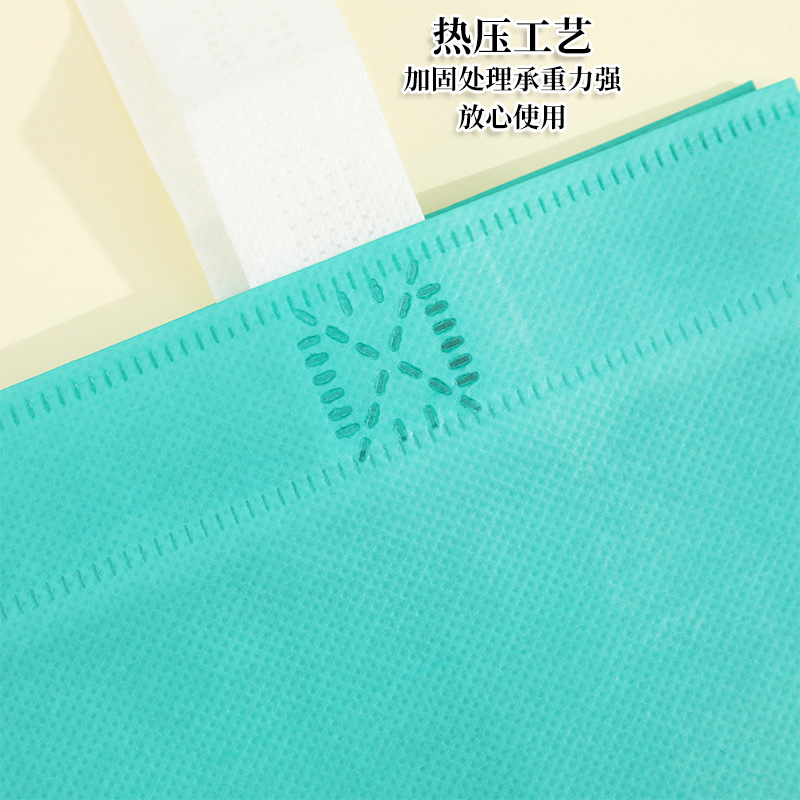 En stock bolso no tejido recubierto al por mayor bolsa de protección del medio ambiente bolsa de tienda de ropa bolso de compras engrosado logotipo imprimible