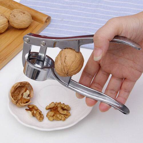Four-in-one manual garlic press, garlic masher, garlic masher, fish scale scraper, bottle opener, walnut clip, manual garlic punch