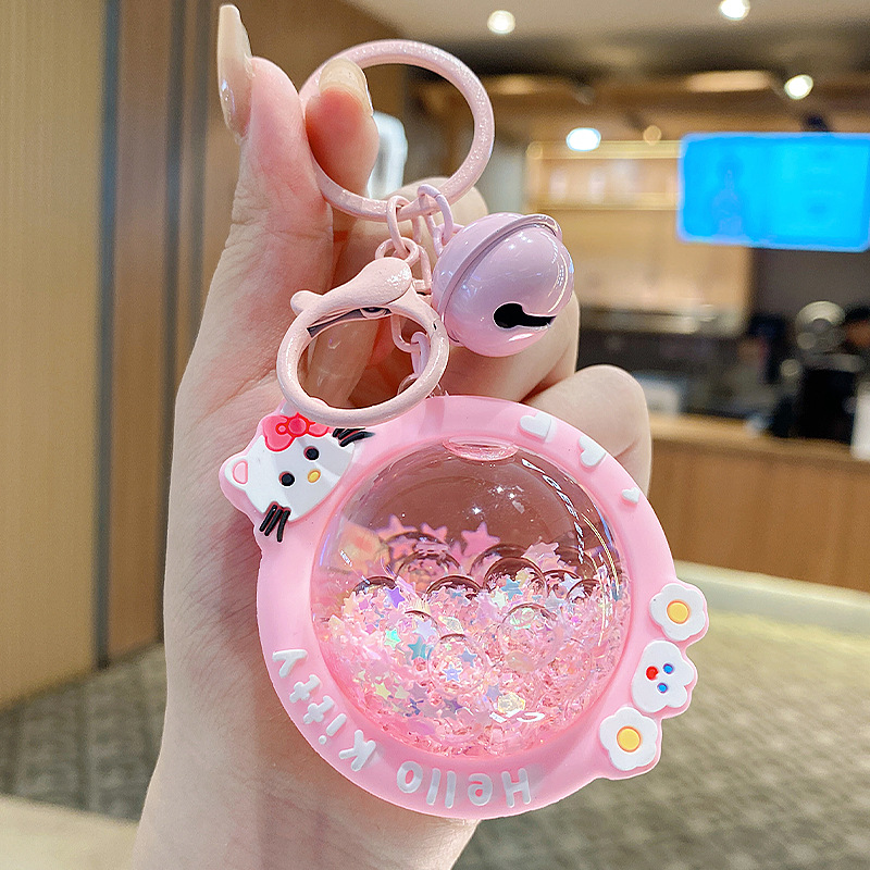 En línea de la celebridad de dibujos animados KT cristal coche llavero mujer libro bolsa colgante pequeña joyería aceite arenas movedizas estrella Delu colgante creativo