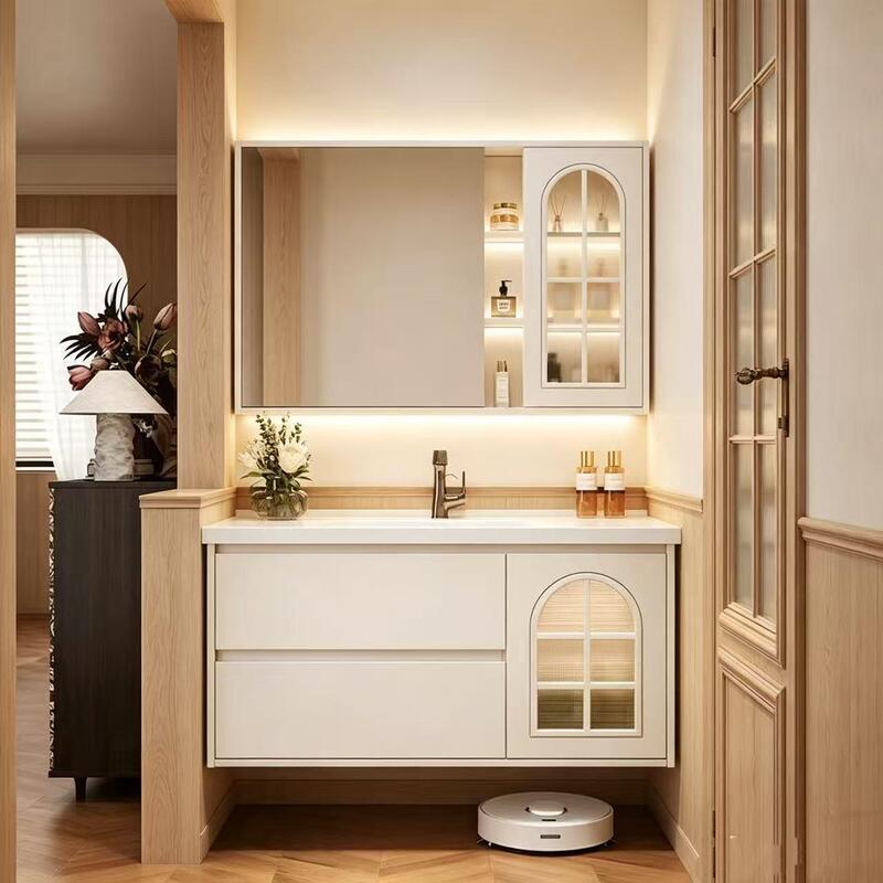 Simple and modern cream-colored bathroom cabinet set, featuring a contemporary and minimalist design with an integrated ceramic basin Simple and modern cream-colored bathroom cabinet set, featuring a contemporary and minimalist design with an integrated ceramic basin
