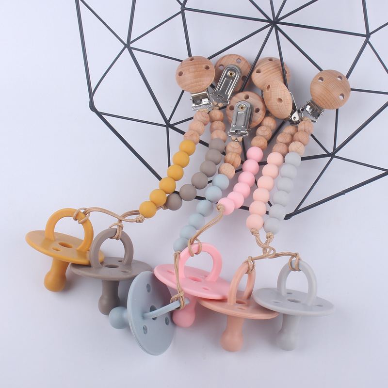 Nuevos suministros para bebés chupete bebé pezón de silicona creativo bebé mordida Cadena de pezón de silicona conjunto de dos piezas