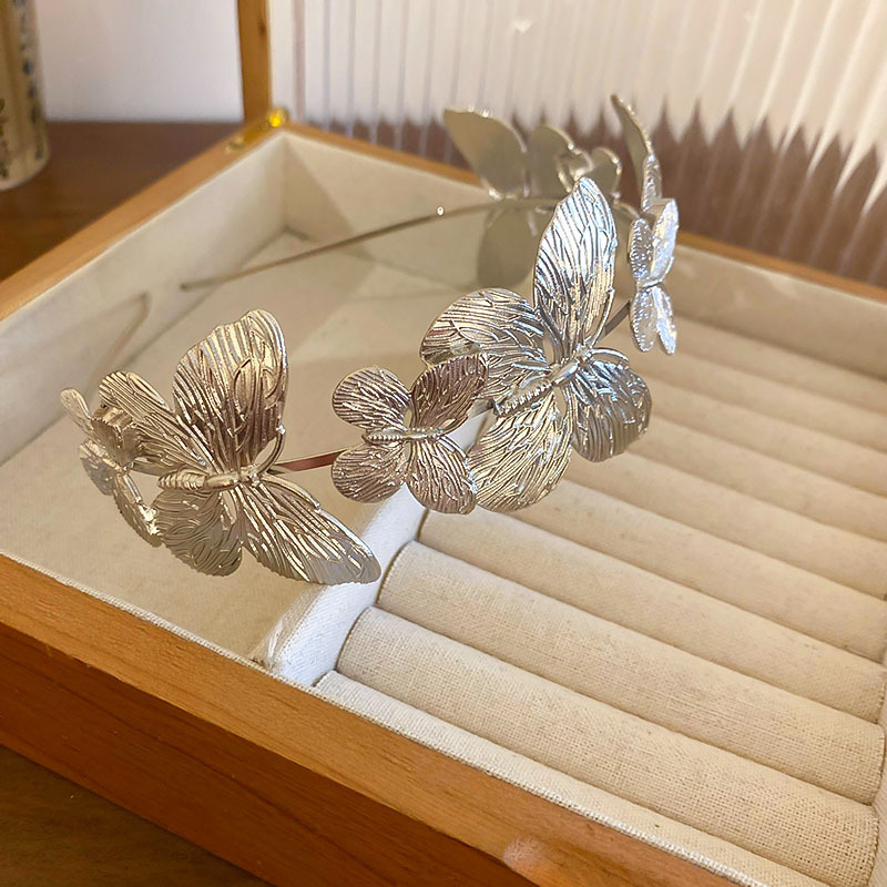 Diadema de metal de mariposa, diadema de presión superior de alta cabeza simple de moda, sentido de alta calidad, personalidad, todo fósforo, nuevos accesorios para el cabello al por mayor