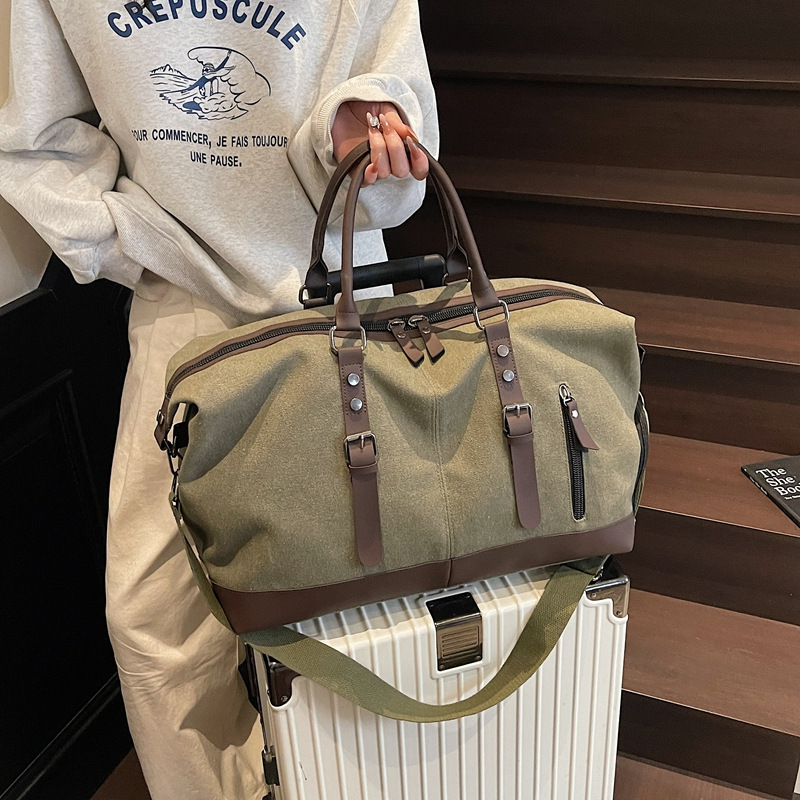 新款出行帆布手提袋旅行包男时尚潮流大容量短途旅游单肩包行李包