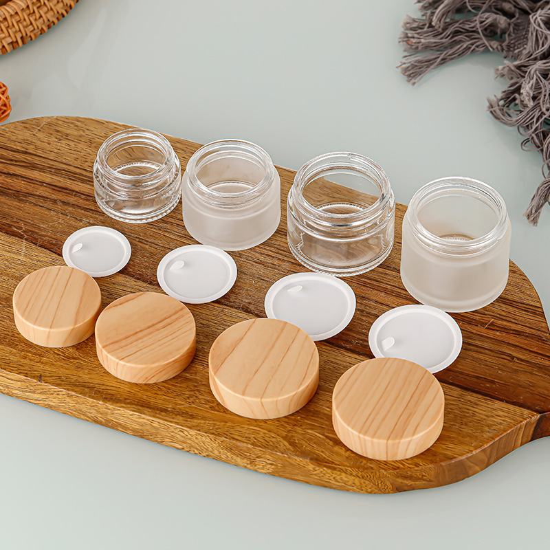 Botella de crema de vidrio con tapa de grano de madera, botella de crema facial esmerilada, botella de cosméticos portátil, botella de crema para ojos, muestra de botella, botella de empaque al por mayor