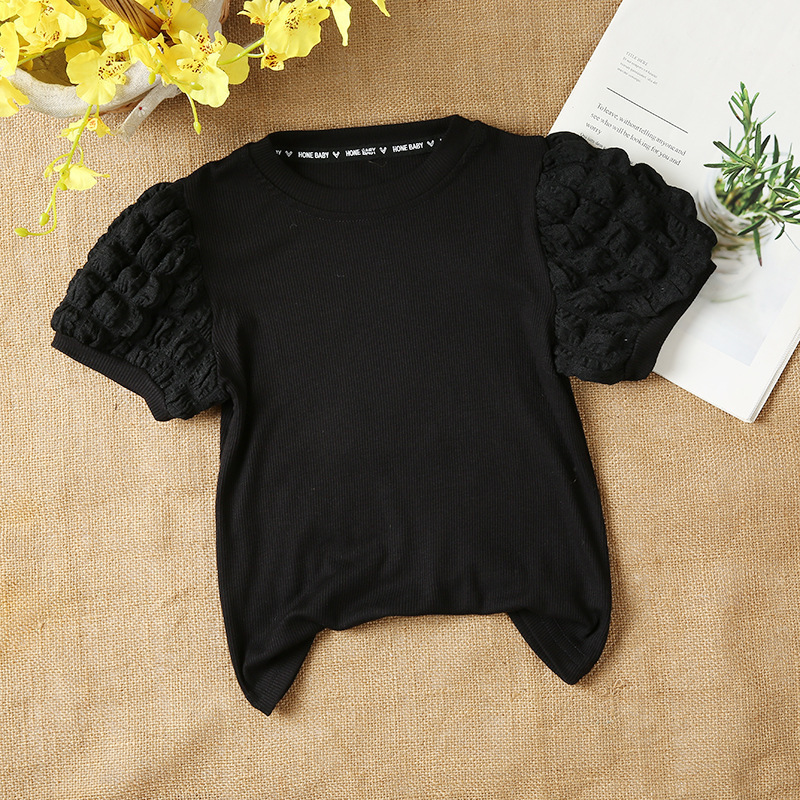 女の子の泡の袖の底のシャツの2025春秋は新型の子供の小さい子供の洋風の長袖のtシャツの韓国版の上着を詰めます。