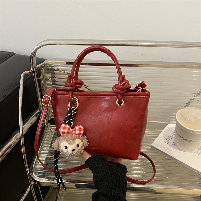 Bolso de moda simple 2024 invierno nuevo estilo retro textura bolso de cubo de moda color sólido viaje mochila de hombro