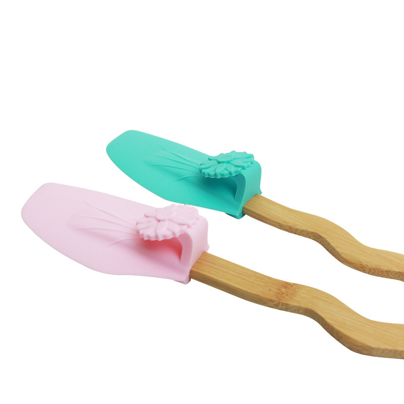 Venta caliente transfronteriza creativa Margarita mango de madera de silicona pala colgante cuenca borde raspador aceite cepillo pala en stock al por mayor