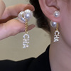 Small earrings with letters from pearl, design silver needle, Chanel style, trend of season