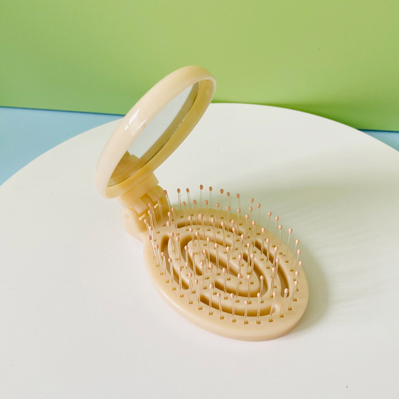 Hogar portátil de viaje cojín de aire peine hueco plegable masaje peine mini hueso contar peine pequeño con espejo al por mayor