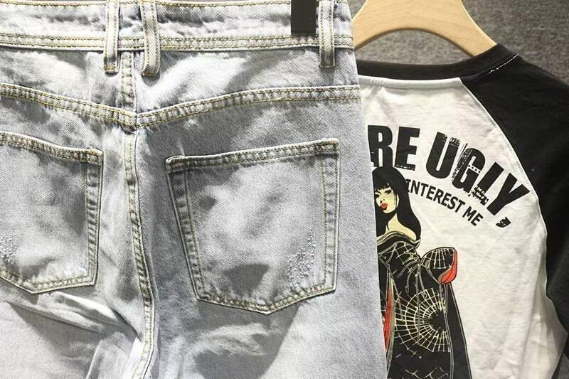 Męskie jeansy vintage z przetarciami o prostym i luźnym kroju_voghion.com