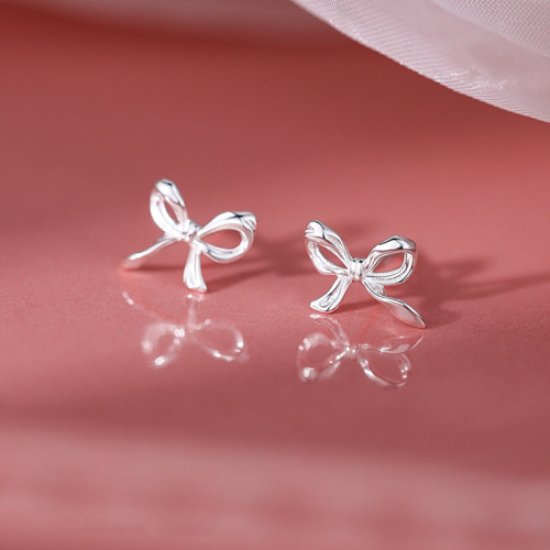 Bow tie earrings for women  trendy simple cold style internet celebrity niche design hollow earrings