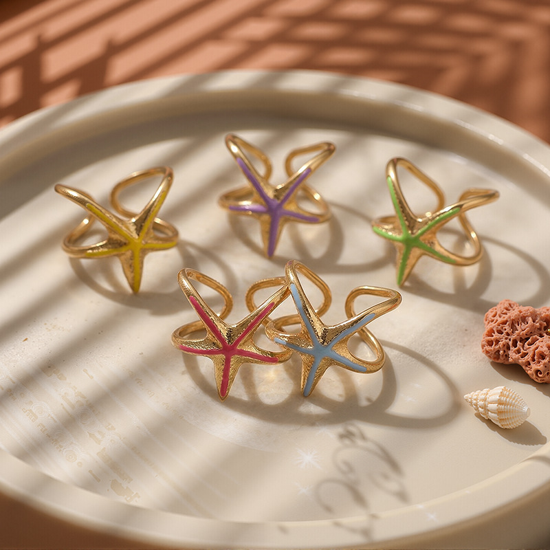 Tina Europa y los Estados Unidos transfronterizos lujo ligero anillo de estrella de mar nicho de diseño de goteo de aceite serie de joyas de mano para mujeres al por mayor