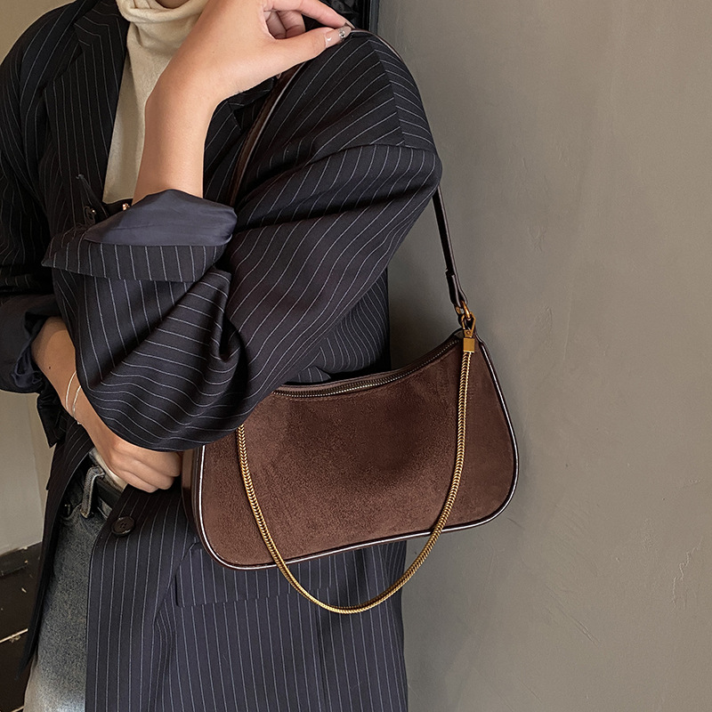 Corea del Sur de cuero de seda bolsos de mano bolsos de mano mujeres 2025 nueva moda cadena de hombro mochila bolsos de palo