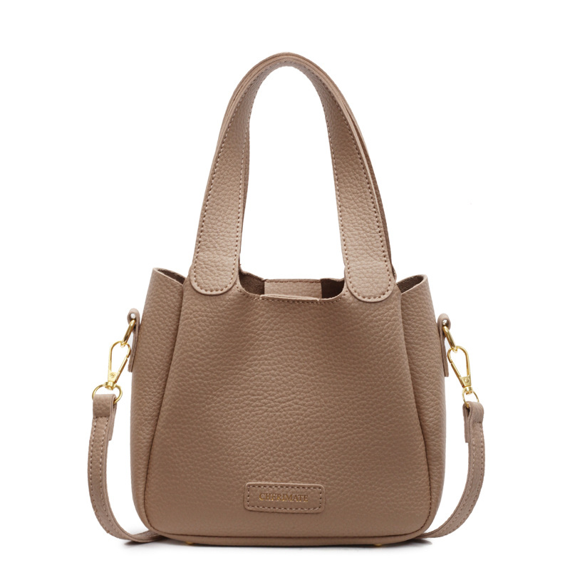 Bolsa de mano ocio transfronteriza versátil para mujeres 2025 nuevo estilo popular retro bolso de cubo de alta calidad simple mochila